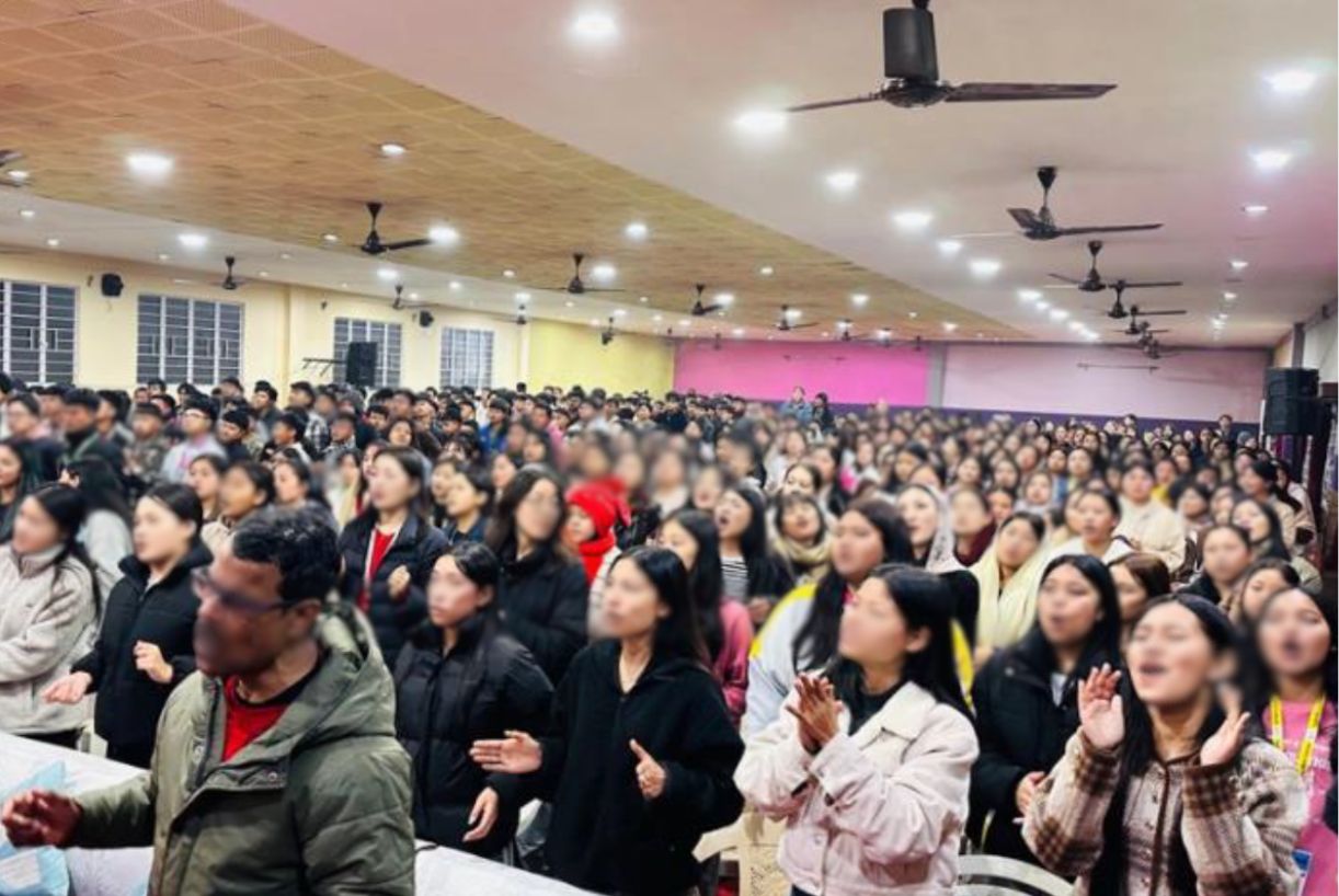 A group of people having their photo taken at church 